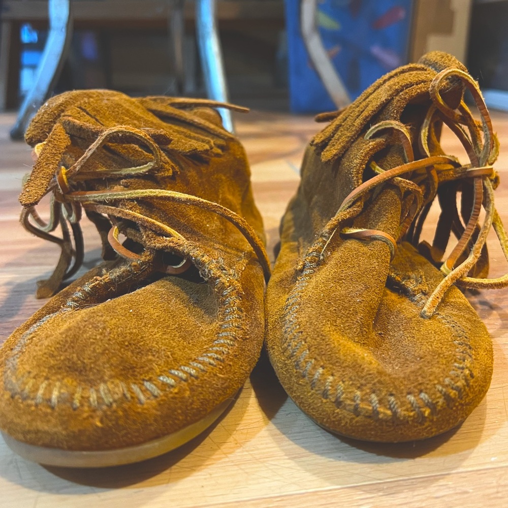 Kids size 2 Minnetonka fringe boots.  Excellent condition; no visible wear.